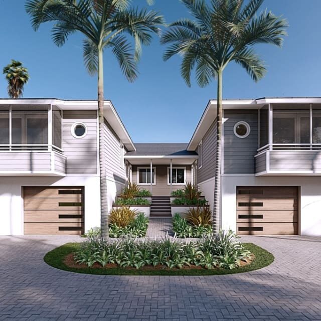 Modern duplex with palm trees and circular driveway under a clear blue sky.