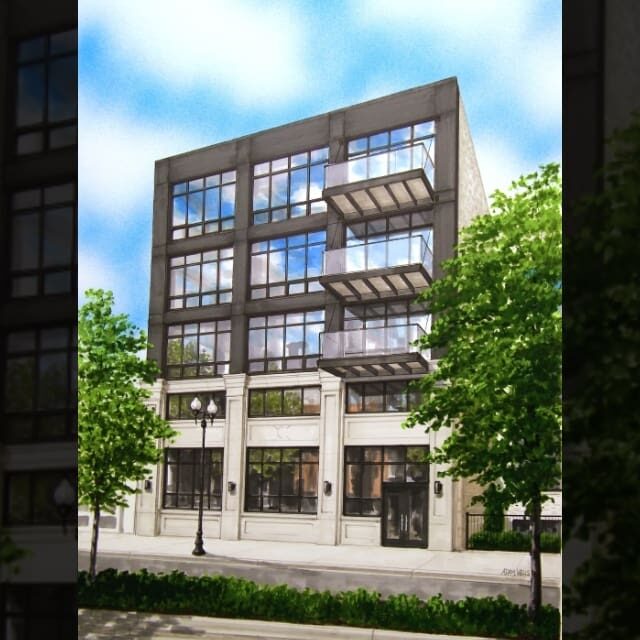 Modern multi-story building with large glass windows and balconies.